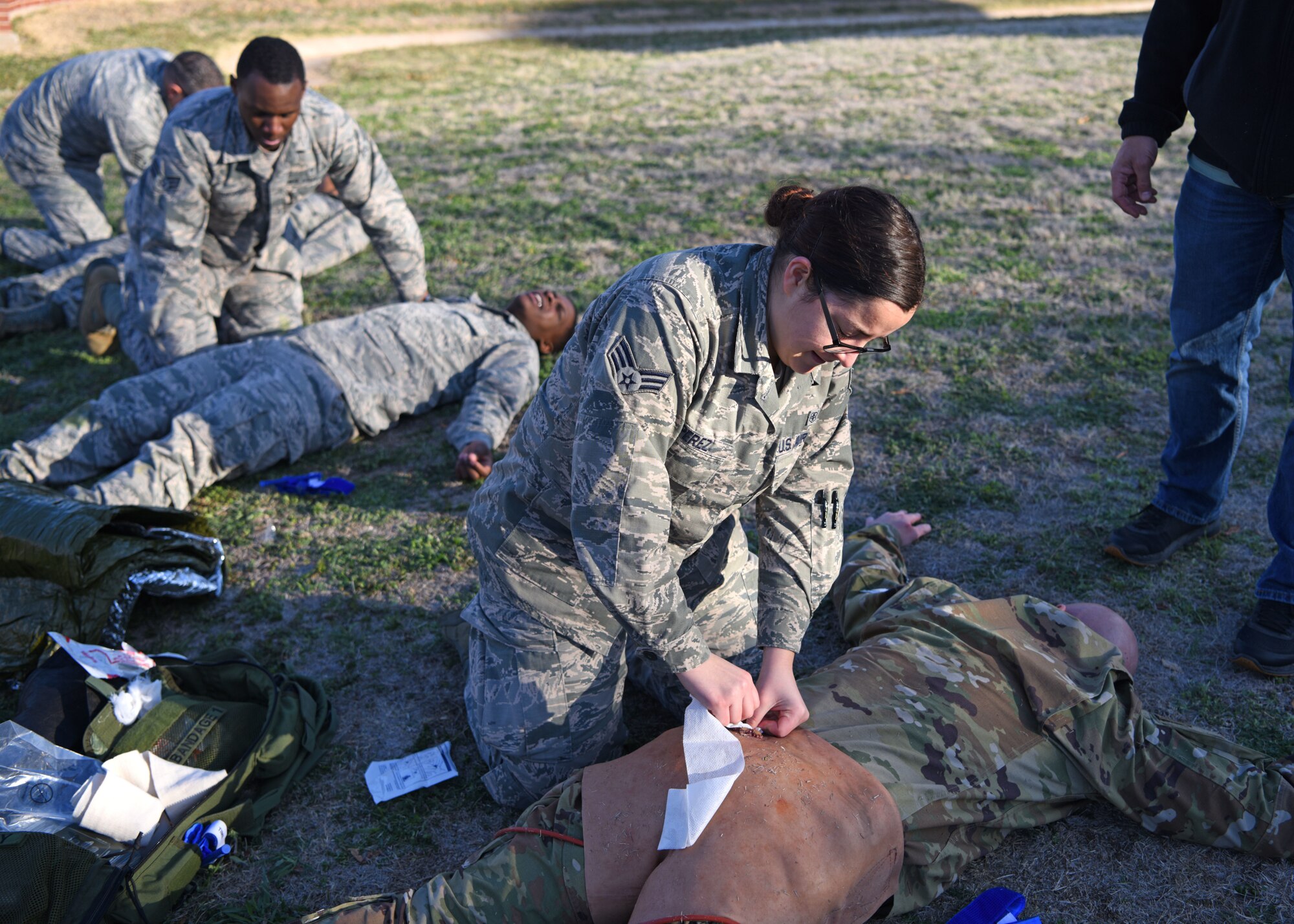 U.S. Air Force medics with the 17th Medical Group perform various first aid to simulated casualties during the Tactical Combat Casualty Care course at Goodfellow Air Force Base, Texas, Feb. 21, 2020. TCCC training has four levels of qualification, tiers one through three are for all other service members and tier four is for medical providers. (U.S. Air Force photo by Airman 1st Class Ethan Sherwood)