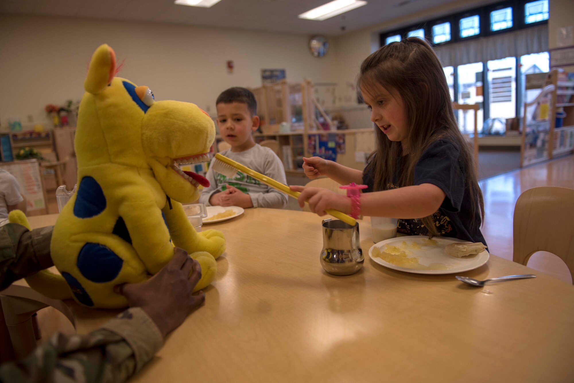 A child from the Holloman Child Development Center tests her brushing techniques on a stuffed animal, Feb. 11, 2020, on Holloman Air Force Base, N.M. February is National Children’s Dental Health Month, and the 49th Operational Readiness Medical Squadron dental flight visits the CDC and both Holloman Elementary and Middle Schools to educate them on the importance of dental health.(U.S. Air Force photo by Staff Sgt. Christine Groening)