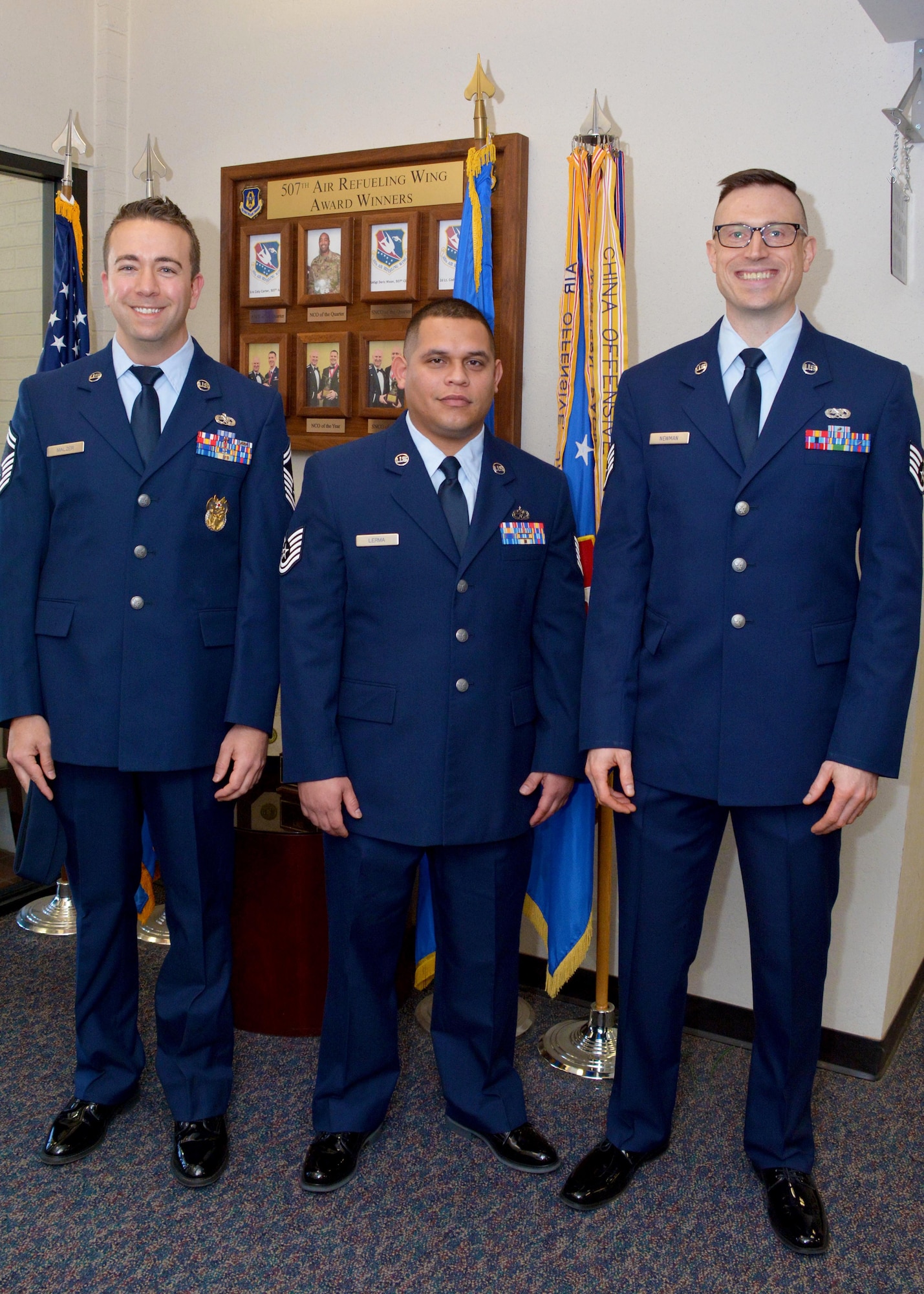Three airmen wait for commissioning interview