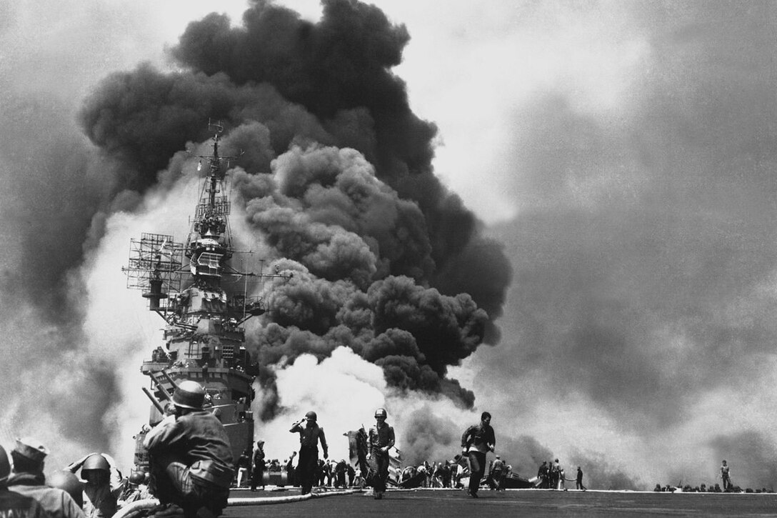 Smoke billows from a burning ship.
