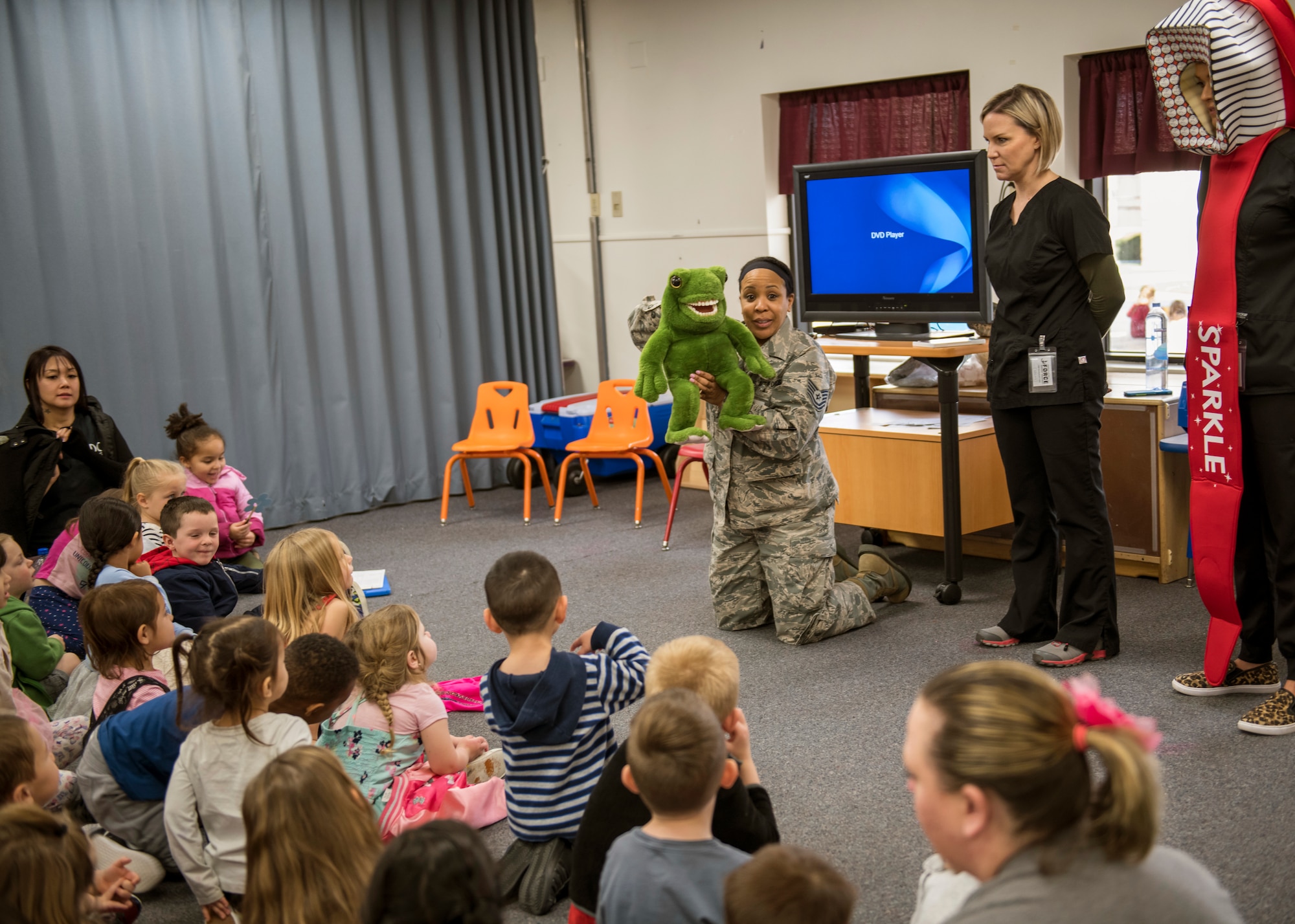 The 412th Medical Group's Tech. Sgt. Halima Burton and Lanie Sheffield give a class on proper teeth-brushing techniques at the Child Development Center on Edwards Air Force Base, California, Feb. 28. (Air Force photo by Giancarlo Casem)