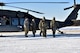 A U.S. Army Soldier teaches 354th Security Forces Squadron (SFS) defenders how to properly remove a casualty from a UH-60 Blackhawk during a medical evacuation (MEDEVAC) exercise on Eielson Air Force Base, Alaska, Feb. 26, 2020. The 354th SFS partnered with 1-52D General Support Aviation Battalion to be able to simulate a real world MEDEVAC. (U.S. Air Force photo by Senior Airman Beaux Hebert)