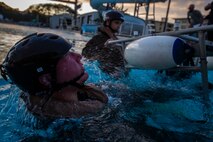 A U.S. Marine with Headquarters Battalion, Marine Corps Base Hawaii, escapes from a chair during Helicopter Underwater Egress Training, MCBH, Feb. 27, 2020. The training provides Marines with confidence to safely and efficiently exit a submerged aircraft in the event of a water landing. (U.S. Marine Corps photo by Cpl. Matthew Kirk)