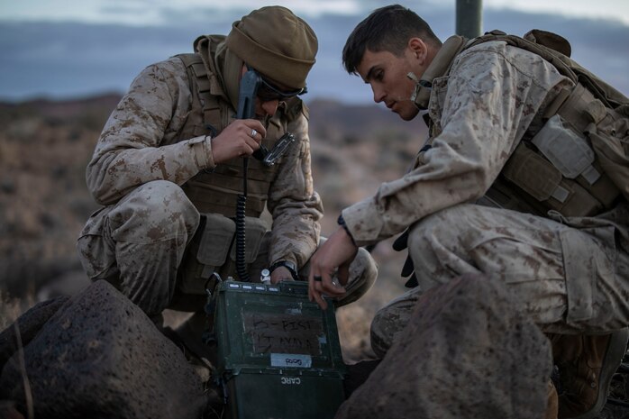 U.S. Marines operate a radio during a Regimental Assault Course (RAC), Marine Air Ground Combat Center, Twentynine Palms, California, Feb. 11, 2020. Marines with 1st Battalion, 3rd Marine Regiment participating in integrated training exercise (ITX) 2-20, conducted a Marine Corps Combat Readiness Evaluation (MCREE), along with various other training events to prepare Marines for deployment. (U.S. Marine Corps photo by Lance Cpl. Jose Angeles)