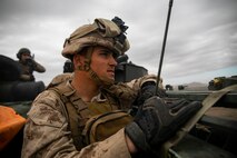 U.S. Marine Corps Lance Cpl. Jason May, radio operator, 1st Battalion 12th Marine Regiment, overlooks the training grounds during a Regimental Assault Course (RAC), Marine Air Ground Combat Center, Twentynine Palms, California, Feb. 11, 2020. Marines with 1st Battalion, 3rd Marine Regiment participating in integrated training exercise (ITX) 2-20, conducted a Marine Corps Combat Readiness Evaluation (MCREE), along with various other training events to prepare Marines for deployment. (U.S. Marine Corps photo by Lance Cpl. Jose Angeles)