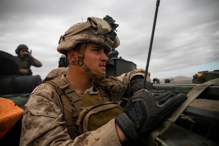U.S. Marine Corps Lance Cpl. Jason May, radio operator, 1st Battalion 12th Marine Regiment, overlooks the training grounds during a Regimental Assault Course (RAC), Marine Air Ground Combat Center, Twentynine Palms, California, Feb. 11, 2020. Marines with 1st Battalion, 3rd Marine Regiment participating in integrated training exercise (ITX) 2-20, conducted a Marine Corps Combat Readiness Evaluation (MCREE), along with various other training events to prepare Marines for deployment. (U.S. Marine Corps photo by Lance Cpl. Jose Angeles)