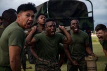 U.S. Marines with Bravo Battery, 1st Battalion, 12th Marine Regiment scream for motivation during the St. Barbara’s day field meet, Marine Corps Base Hawaii, Feb. 27, 2020. The St. Barbara’s day field meet is an annual celebration in honor of St. Barbara, the patron saint of artillery, to build camaraderie and friendly competition within the unit. The celebration consists of relay races, a trebuchet competition, and a High Mobility Multipurpose Wheeled Vehicle push. (U.S. Marine Corps photo by Lance Cpl. Samantha Sanchez)