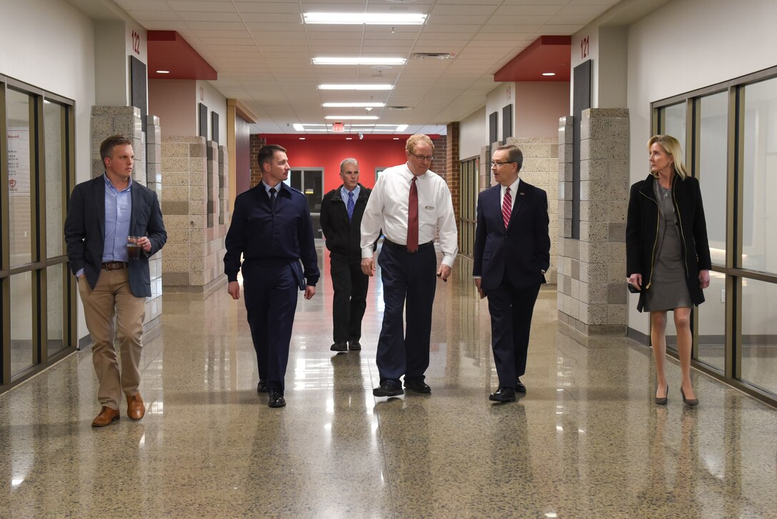 Col. John Schutte, 19th Airlift Wing commander, along with members of the Association of Defense Communities tours Jacksonville High School in Jacksonville, Arkansas.