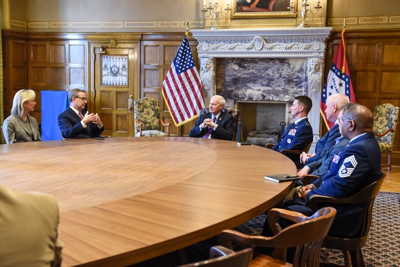 U.S. Air Force Col. John Schutte, 19th Airlift Wing commander, along with members of the Association of Defense Communities meet with Arkansas Gov. Asa Hutchinson in Little Rock, Arkansas.