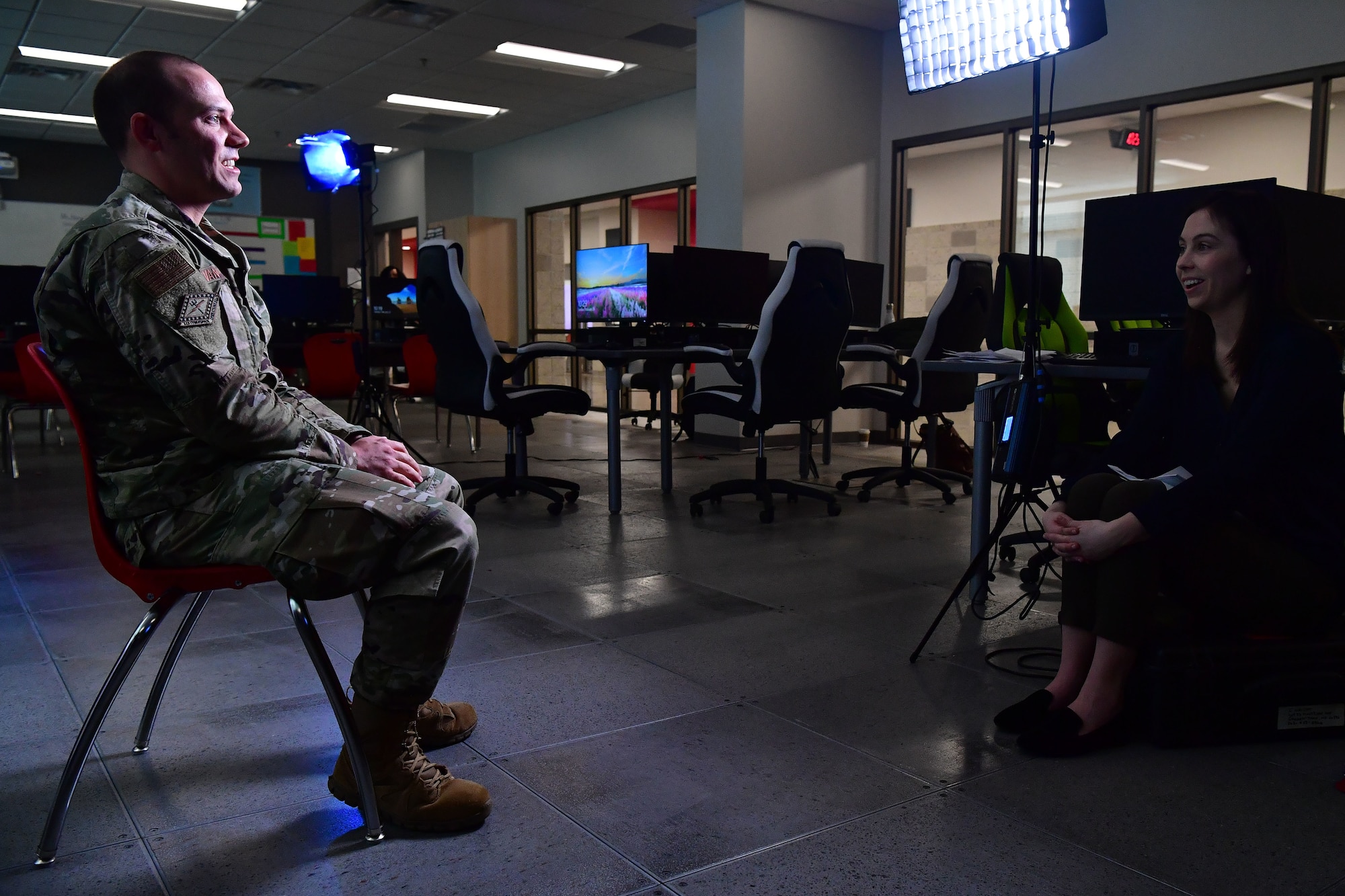 Grace Marvin, Association of Defense Communities director of communications, conducts an interview with U.S. Air Force 1st Lt. Thomas Van Dorple, 223rd Cyberspace Operations Squadron flight commander.