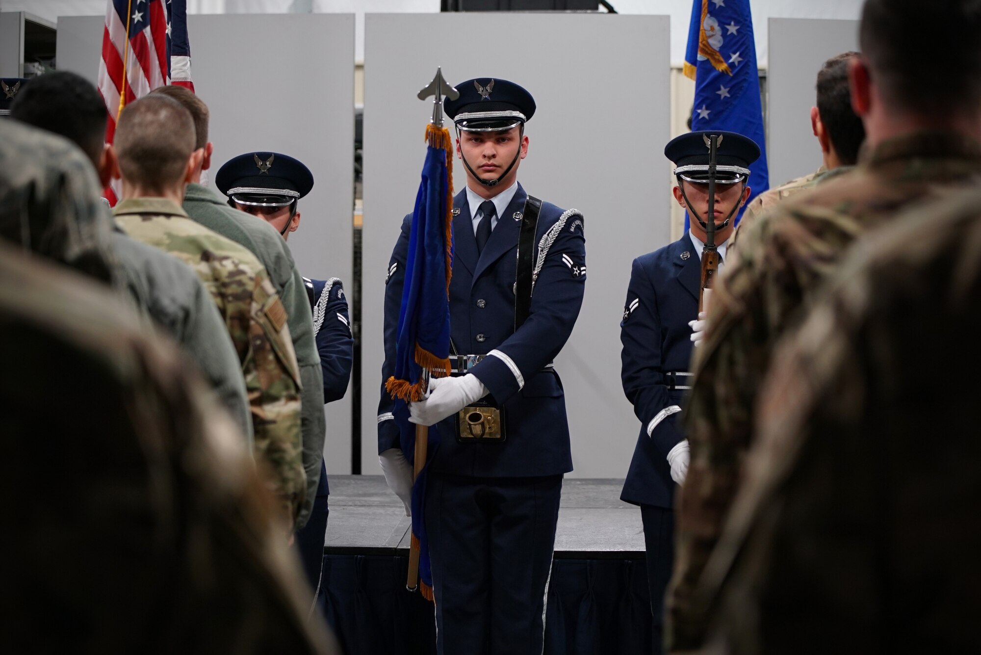 Airman 1st Class Cody Nguyen-Gorter, 319th Reconnaissance Wing honor guardsman, presents the colors during a memorial ceremony Dec. 20, 2019, on Grand Forks Air Force Base, North Dakota. The ceremony was attended by members of the 319th Security Forces Squadron in memory of one of their military working dogs, “Dex.” (U.S. Air Force photo by Senior Airman Elora J. Martinez)