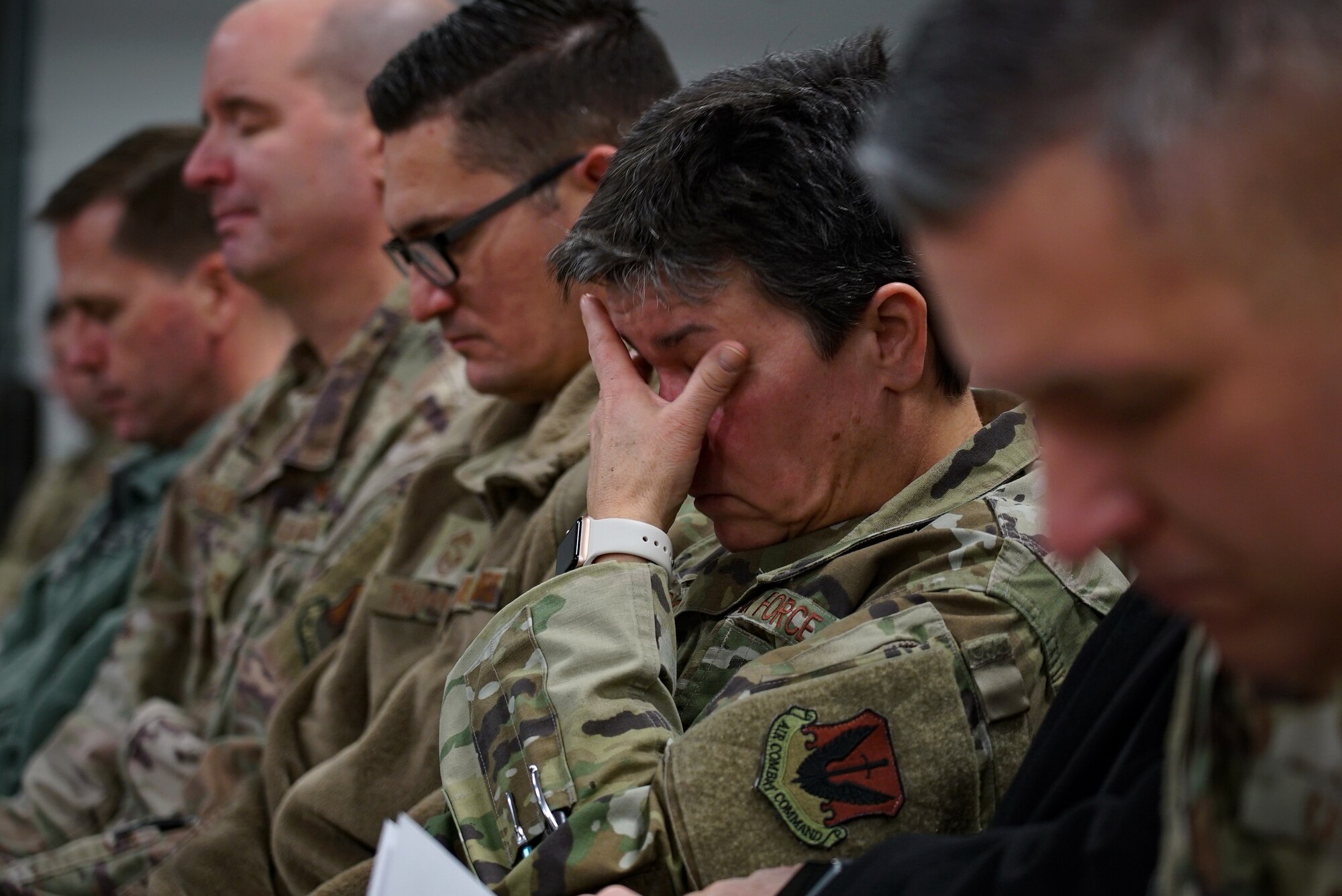 Leaders with the 319th Reconnaissance Squadron participate in a moment of silence during a memorial service Dec. 20, 2019, on Grand Forks Air Force Base, North Dakota. Members of the 319th Security Forces Squadron were also in attendance to honor the life of one of their military working dogs, “Dex,” who served alongside his handler, Staff Sgt. Sean King. (U.S. Air Force photo by Senior Airman Elora J. Martinez)