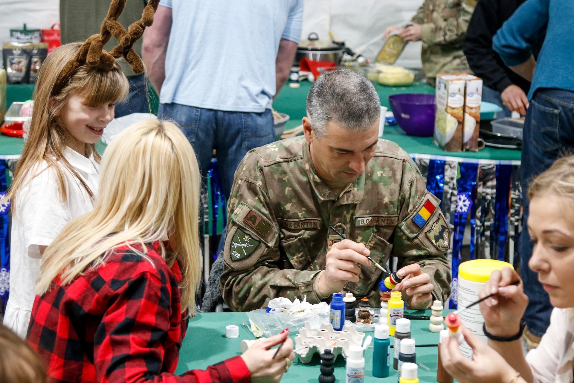 NATO Soldiers give local children holiday cheer during “Operation Christmas”