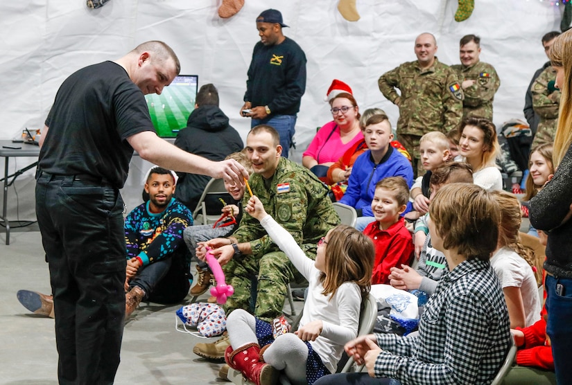 NATO Soldiers give local children holiday cheer during “Operation Christmas”