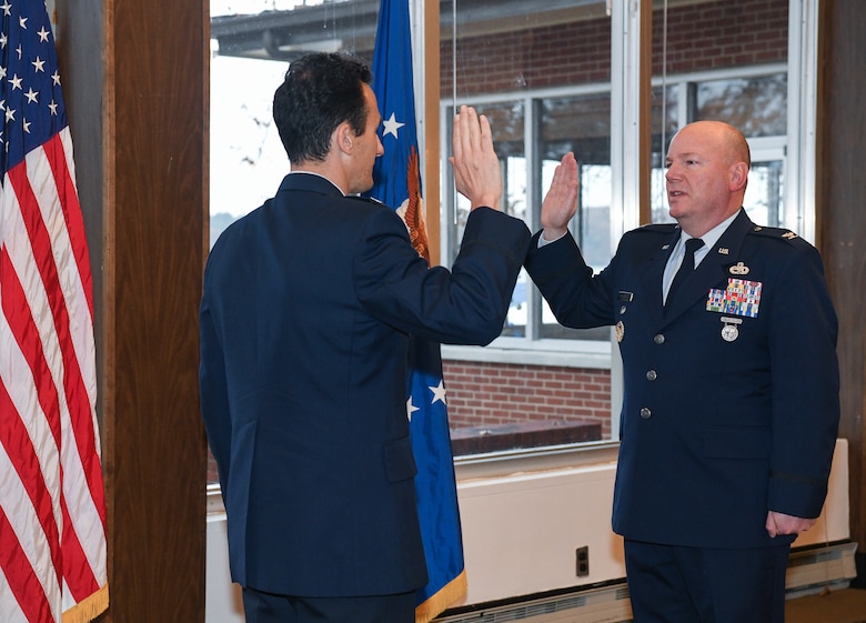 Col. Jeffrey Geraghty, Arnold Engineering Development Complex commander, administers the oath of office to newly-promoted Col. Jeffrey Burdette during a promotion ceremony Nov. 22 at the Arnold Lakeside Center on Arnold Air Force Base. Burdette is the chief of the AEDC Test Systems Sustainment Division at Arnold. He assumed leadership of the division in August. (U.S. Air Force photo by Jill Pickett)