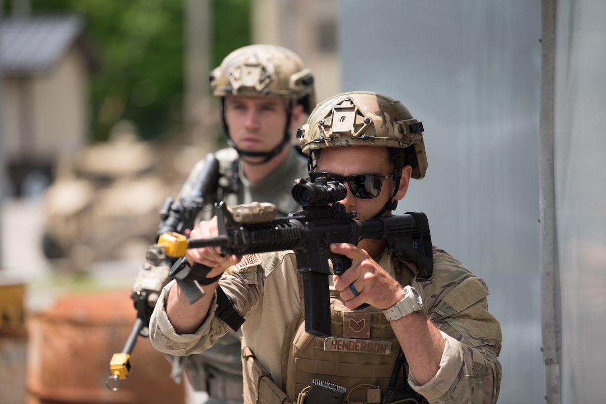 Staff Sgt. Haddon Henderson, a fire team leader from the Kentucky Air National Guard’s 123rd Security Forces Squadron, executes a simulated short-notice mission to degrade terrorist capabilities during a field training exercise at Fort Knox, Ky., May 21, 2019. The exercise was designed to test security tactics in a simulated Afghan village from May 18-22. (U.S. Air National Guard photo by Phil Speck)