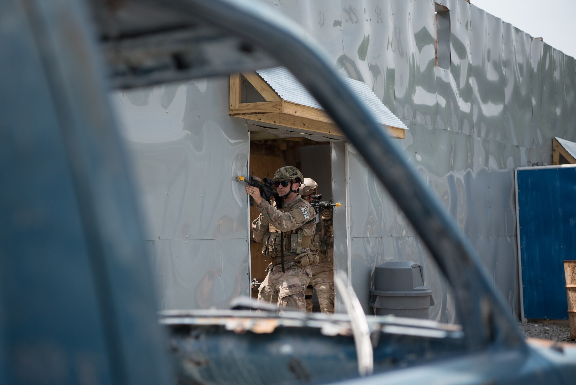 Staff Sgt. Cameron Blankenship, a fire team leader from the Kentucky Air National Guard’s 123rd Security Forces Squadron, executes a simulated short-notice mission to degrade terrorist capabilities during a field training exercise at Fort Knox, Ky., May 21, 2019. The exercise was designed to test security tactics in a simulated Afghan village from May 18-22. (U.S. Air National Guard photo by Phil Speck)