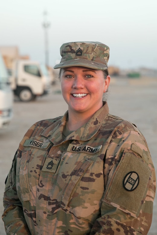 U.S. Army Sgt. First Class Meredith Kiser, a combat medic in the 30th Armored Brigade Combat Team, North Carolina National Guard, is recognized after being presented a general officer coin by U.S. Army Maj. Gen. Gordon Ellis, commander of Task Force Spartan and the 38th Infantry Division, Indiana National Guard at Camp Buehring, Kuwait, Dec. 27, 2019 for her outstanding work during a recent command inspection of the unit's combat medic training program.