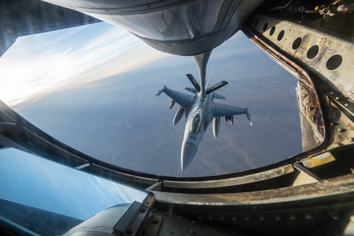 Master Sgt. Phil Speck, superintendent of the 123rd Airlift Wing Public Affairs Office, earned third place in the 2018 Air National Guard Military Photographer of the Year contest for a broad spectrum of work while deployed and at home station, including this photo of an F-16 Fighting Falcon refueling in the skies over Afghanistan Jan. 17, 2018. (U.S. Air National Guard photo by Master Sgt. Phil Speck)