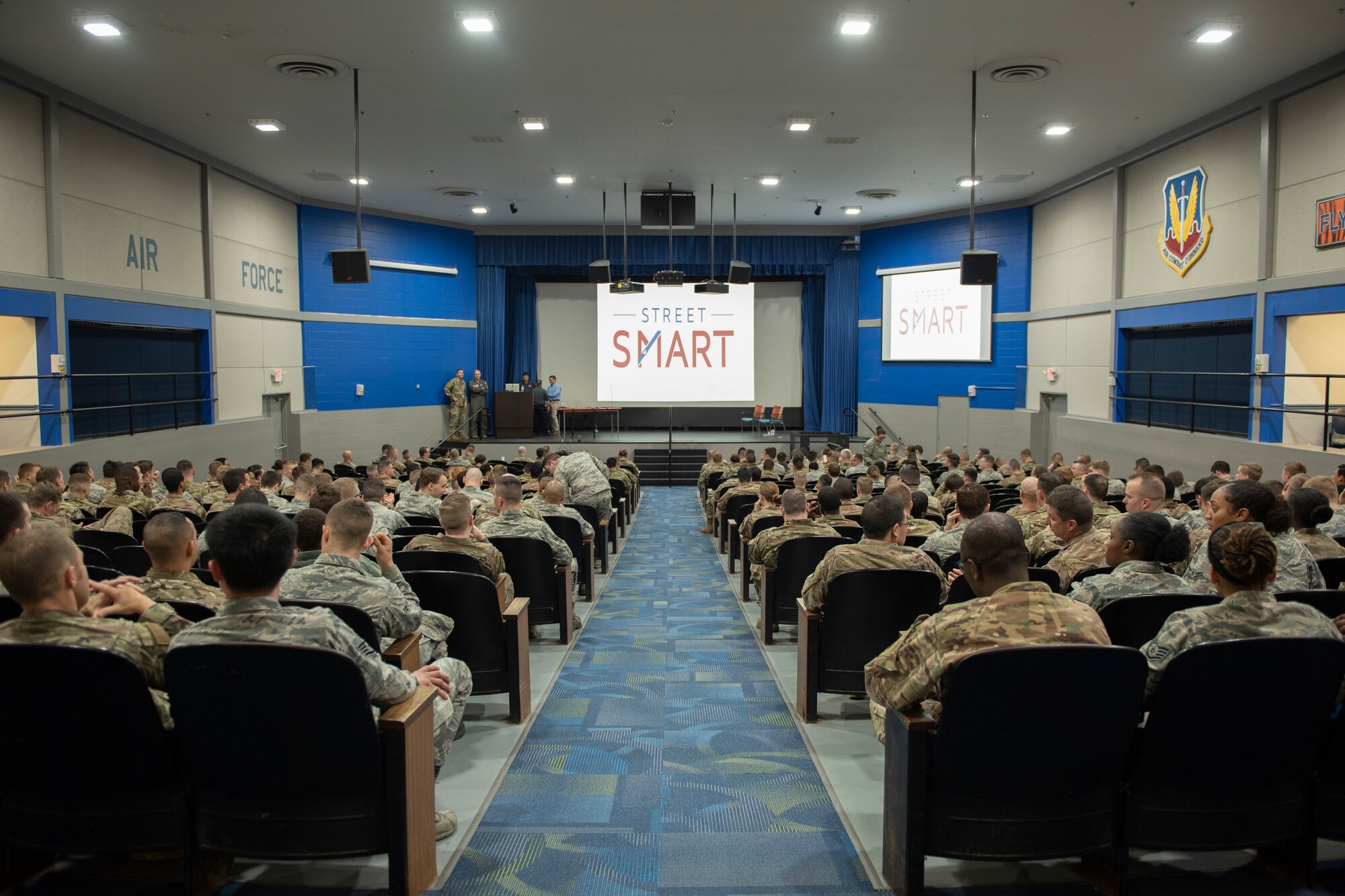 A photo of Airmen waiting for a safety presentation