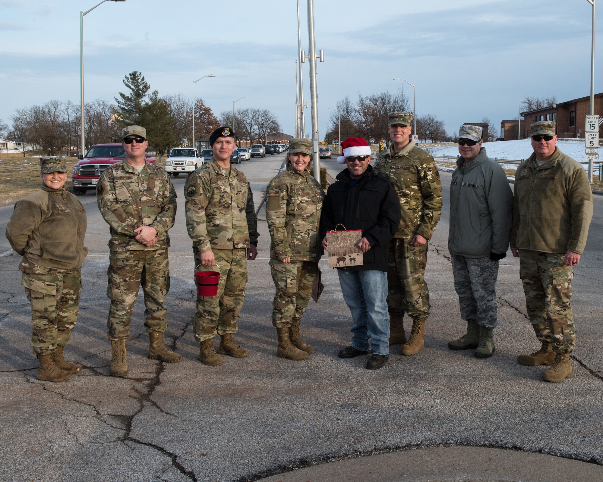 Chief master sergeants from Whiteman Air Force Base, Missouri, pose for a photo on Dec. 20, 2019. The Chiefs took the opportunity to strengthen connections by handing out candy canes and wishing Whiteman Airmen and families a happy holiday. (U.S. Air Force photo by Airman 1st Class Christina Carter)