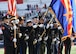 photo of U.S. servicemembers and first responders presenting the colors during the national anthem at the Arizona Bowl football game