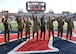 Photo of Arizona servicemembers being recognized on a field at the Arizona Bowl football game