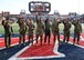 Photo of Arizona servicemembers being recognized on a field at the Arizona Bowl football game