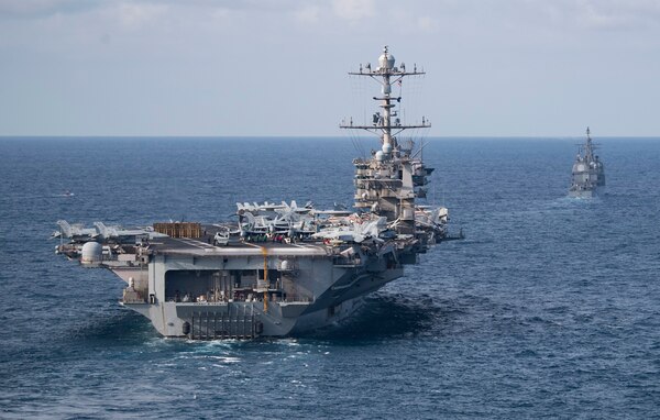 he Nimitz-class aircraft carrier USS Harry S. Truman (CVN 75), front, and the Ticonderoga-class guided-missile cruiser USS Normandy (CG 60) transit the Atlantic Ocean.
