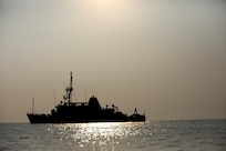Mine countermeasures ship USS Devastator (MCM 6) navigates through the Arabian Gulf. Devastator is deployed to the U.S. 5th Fleet area of operations in support of Operation Sentinel