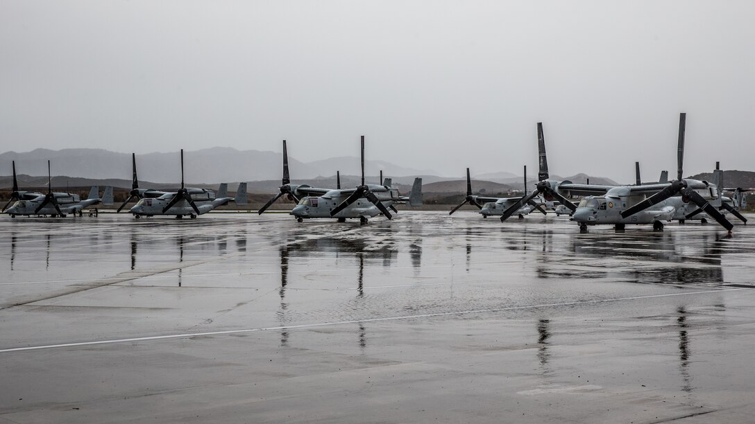 U.S. Marine MV-22B Osprey tiltrotor aircraft  sit in the rain on Marine Corps Air Station Camp Pendleton, California, Dec. 23.