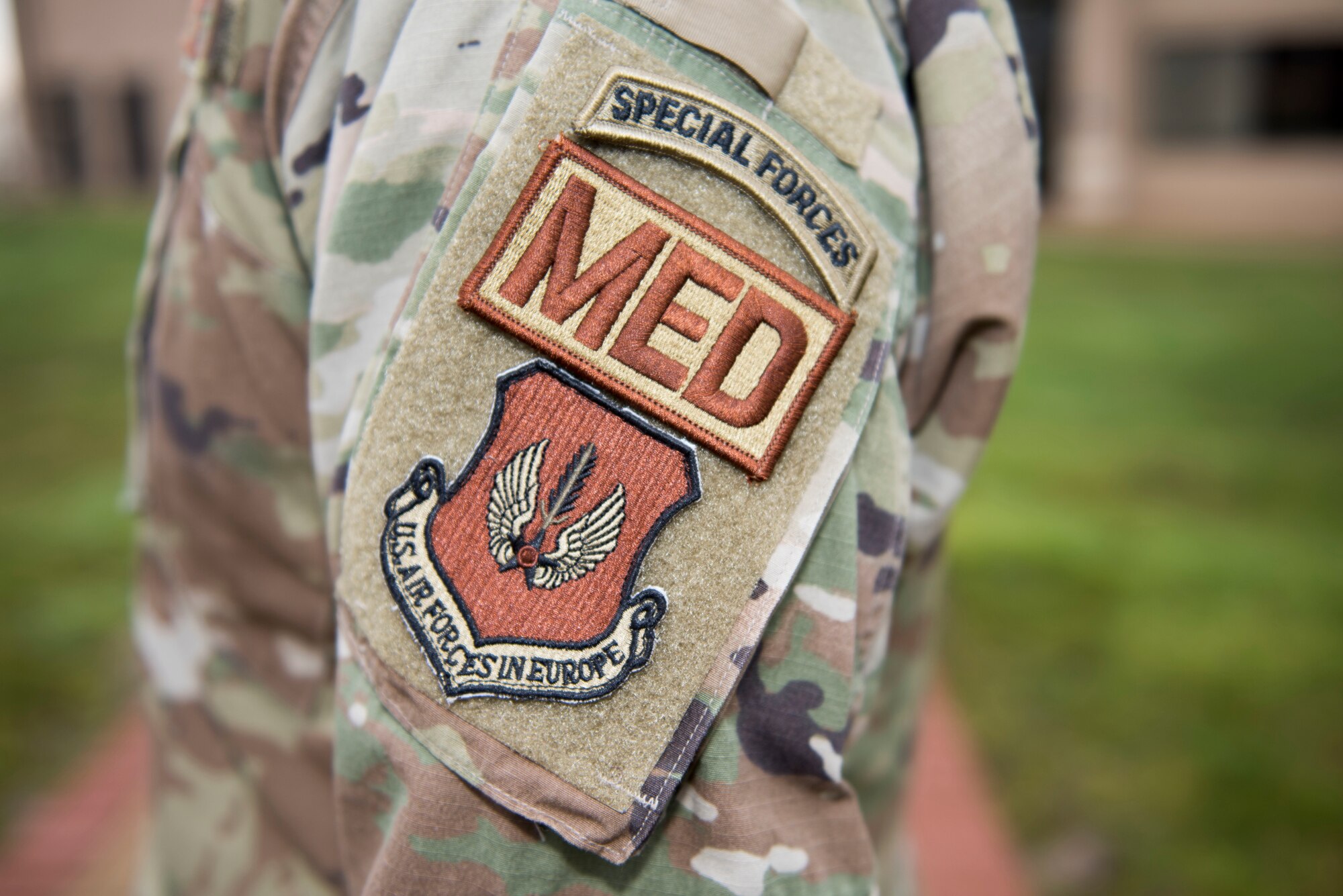 U.S. Air Force Lt. Col. Robert Heil, 422nd Medical Squadron commander, displays his military patches at the 423rd MDS clinic at RAF Alconbury, England, December 18, 2019. Heil spent 12 years in the Army as a Special Forces medic and now serves as an Air Force medical squadron commander in the 501st Combat Support Wing. (U.S. Air Force photo by Airman 1st Class Jennifer Zima)