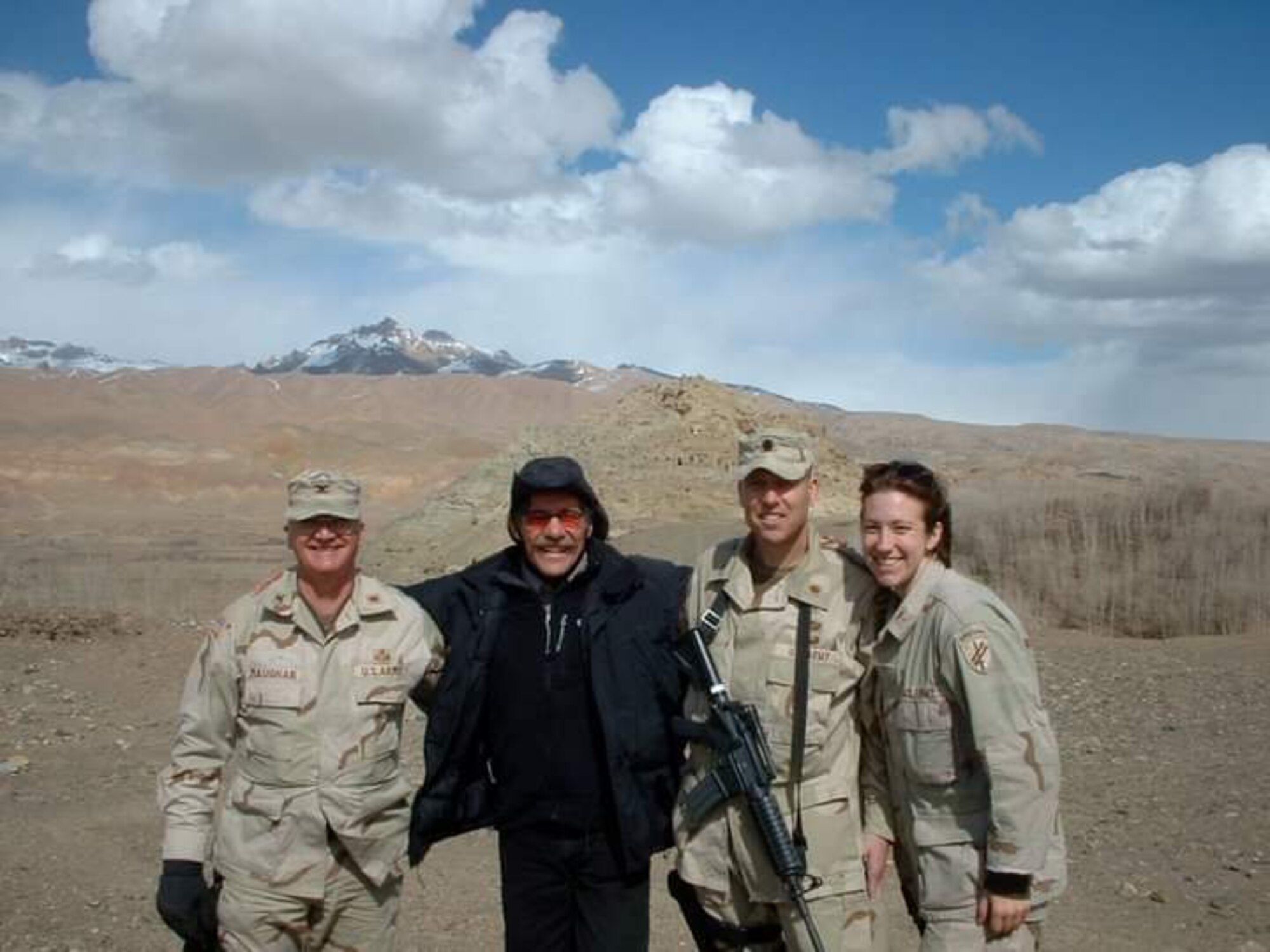 Now-Air Force Lt. Col. Elizabeth Hoettels, 423rd Medical Squadron commander, poses for a photo during a deployment in Afghanistan in front of Ghenghis Khan's castle during her prior career as an Army Civil Affairs officer. Hoettels served 10 years in the Army before transitioning to the Air Force. (Courtesy photo)