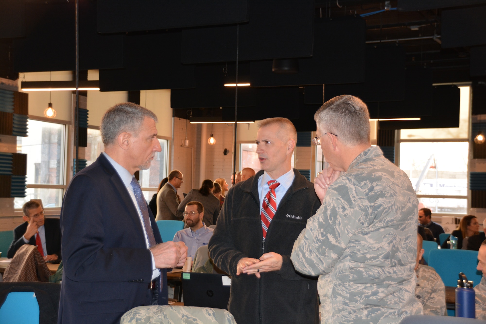 Dr. Kevin Geiss, Airman Systems Directorate director, talks with Dr. David Neri, Air Force Medical Service Chief Scientist, and Col. LaFrance during the inaugural Physiological Episodes Mitigation Technology Summit and Industry Day in Dayton, Ohio, Dec. 17-18.