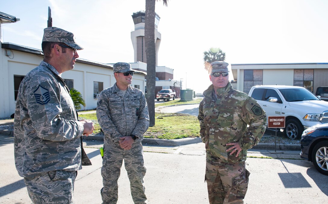 U.S. Air Force Col. Brian Laidlaw, 325th Fighter Wing commander (left), meets with U.S. Air Force Senior Airman Christian Gosnell, 325th Civil Engineer Squadron driver operator (center), and U.S. Air Force Master Sgt. Michael Nally, 325th CES assistant cheif of operations (left), to talk about their morning fire exercise at Tyndall Air Force Base, Fla., Dec. 20, 2019. Gosnell was selected to have the wing commander come out and have a hands on experience with his job at the fire department. (U.S. Air Force photo by Senior Airman Stefan Alvarez)