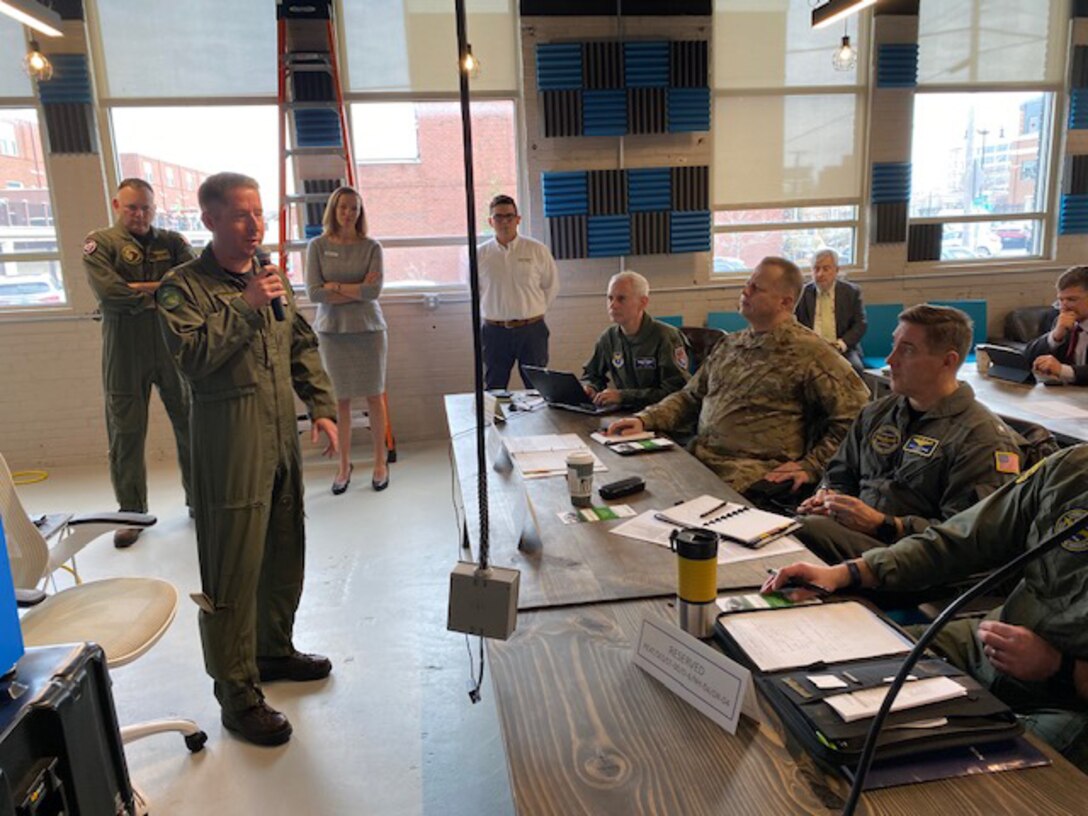 Air Force and Navy officials listen to a briefing during the Physiological Episodes Mitigation Technology Summit and Industry Day in Dayton, Ohio, Dec. 17-18.