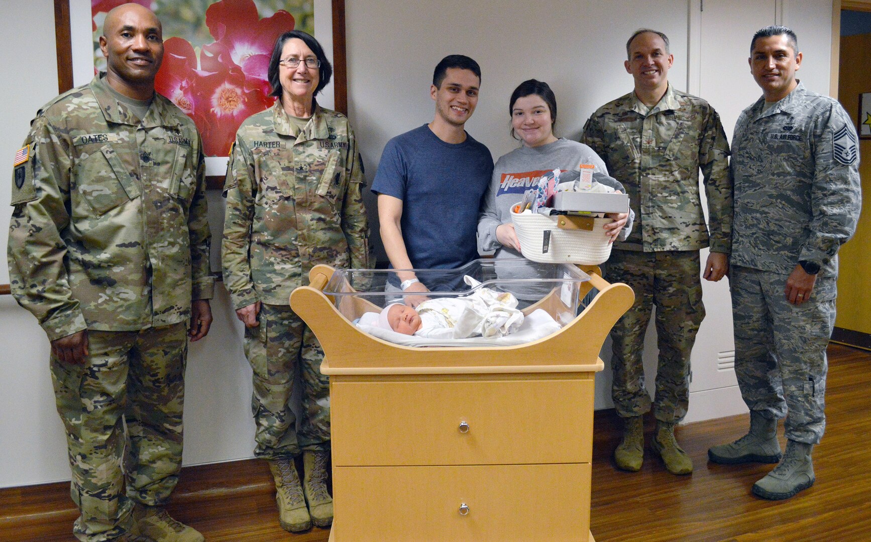 The Brooke Army Medical Center and 959th Medical Group command teams pose for a photo with Airman 1st Class Anna Tritley and her husband, Sean, Jan. 3, 2020 to congratulate them on the birth of their daughter, Cora Noel. The 7-pound, 9-ounce, 19.5-inch-long baby girl was BAMC’s first baby of the new year, born at 1 a.m. Jan. 1, 2020.