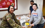Brig. Gen. Wendy Harter, Brooke Army Medical Center commanding general, presents a gift basket from the BAMC Auxiliary to Airman 1st Class Anna Tritley and her husband, Sean, Jan. 3, 2020 to congratulate them on the birth of their daughter, Cora Noel. The 7-pound, 9-ounce, 19.5-inch-long baby girl was BAMC’s first baby of the new year, born at 1 a.m. on Jan. 1, 2020.