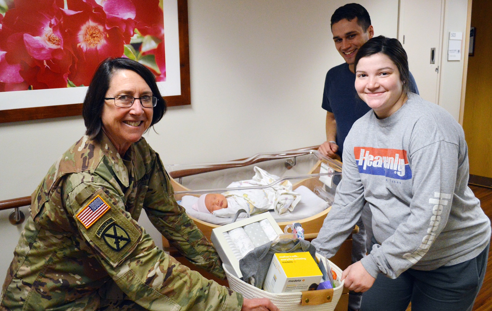 Brig. Gen. Wendy Harter, Brooke Army Medical Center commanding general, presents a gift basket from the BAMC Auxiliary to Airman 1st Class Anna Tritley and her husband, Sean, Jan. 3, 2020 to congratulate them on the birth of their daughter, Cora Noel. The 7-pound, 9-ounce, 19.5-inch-long baby girl was BAMC’s first baby of the new year, born at 1 a.m. on Jan. 1, 2020.