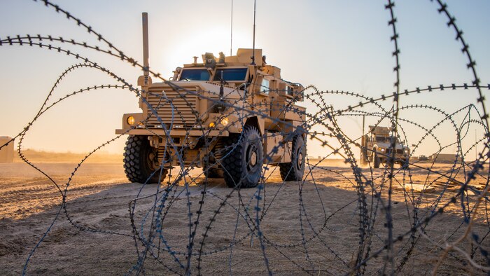 U.S. Marines drive Mine Resistant Ambush Protected All-Terrain Vehicles during a tactical vehicle driving course in Kuwait, Dec. 21.