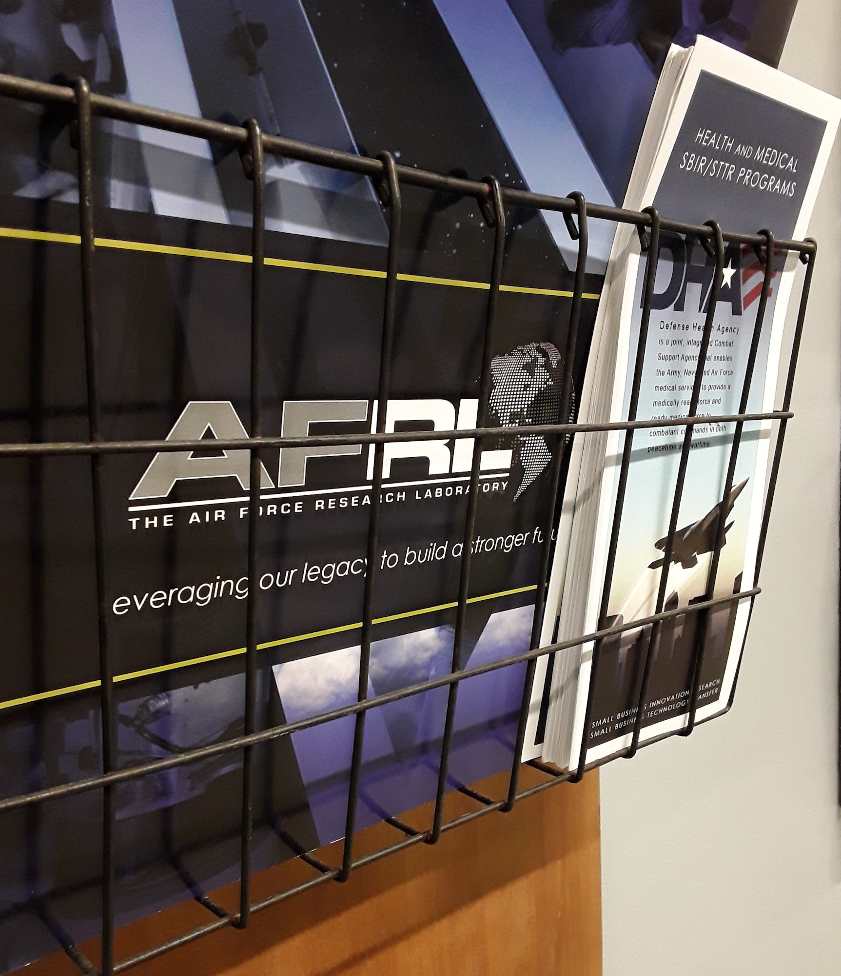 Marketing materials are displayed at the Wright Brothers Institute's Small business Hub in downtown Dayton during the inaugural Physiological Episodes Mitigation Technology Summit and Industry Day Dec. 17-18.