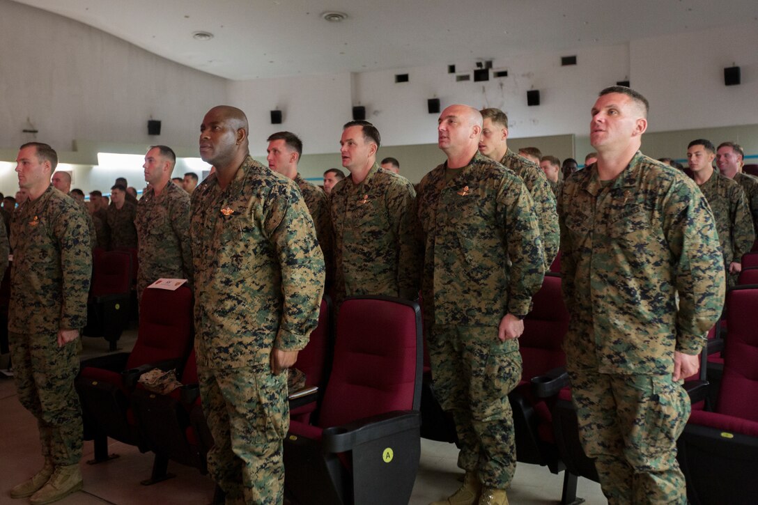 U.S. Marines with 3rd Reconnaissance Battalion, 3rd Marine Division, stand at the position of attention during a relief and appointment ceremony at Camp Schwab, Okinawa, Japan, Dec. 18, 2019. This traditional ceremony symbolizes the passing of responsibilities from Sgt. Maj. Marcos A. Cordero to Sgt. Maj. Aaron Colling. (U.S. Marine Corps photo by Cpl. Cameron Parks)