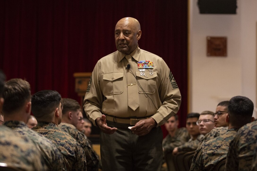 Retired Sgt. Maj. John Canley, Medal of Honor Recipient, speaks to Marines of the 31st Marine Expeditionary Unit and 3rd Marine Expeditionary Force on Camp Hansen, Okinawa, Japan, Dec. 11, 2019. Sgt. Maj. Canley received the Medal of Honor for his valor in combat during the Vietnam War. The 31st MEU, the Marine Corps' only continuously forward-deployed MEU, provides a flexible and lethal force ready to perform a wide range of military operations as the premier crisis response force in the Indo-Pacific region. (Official U.S. Marine Corps photo by Lance Cpl. Joshua Sechser)