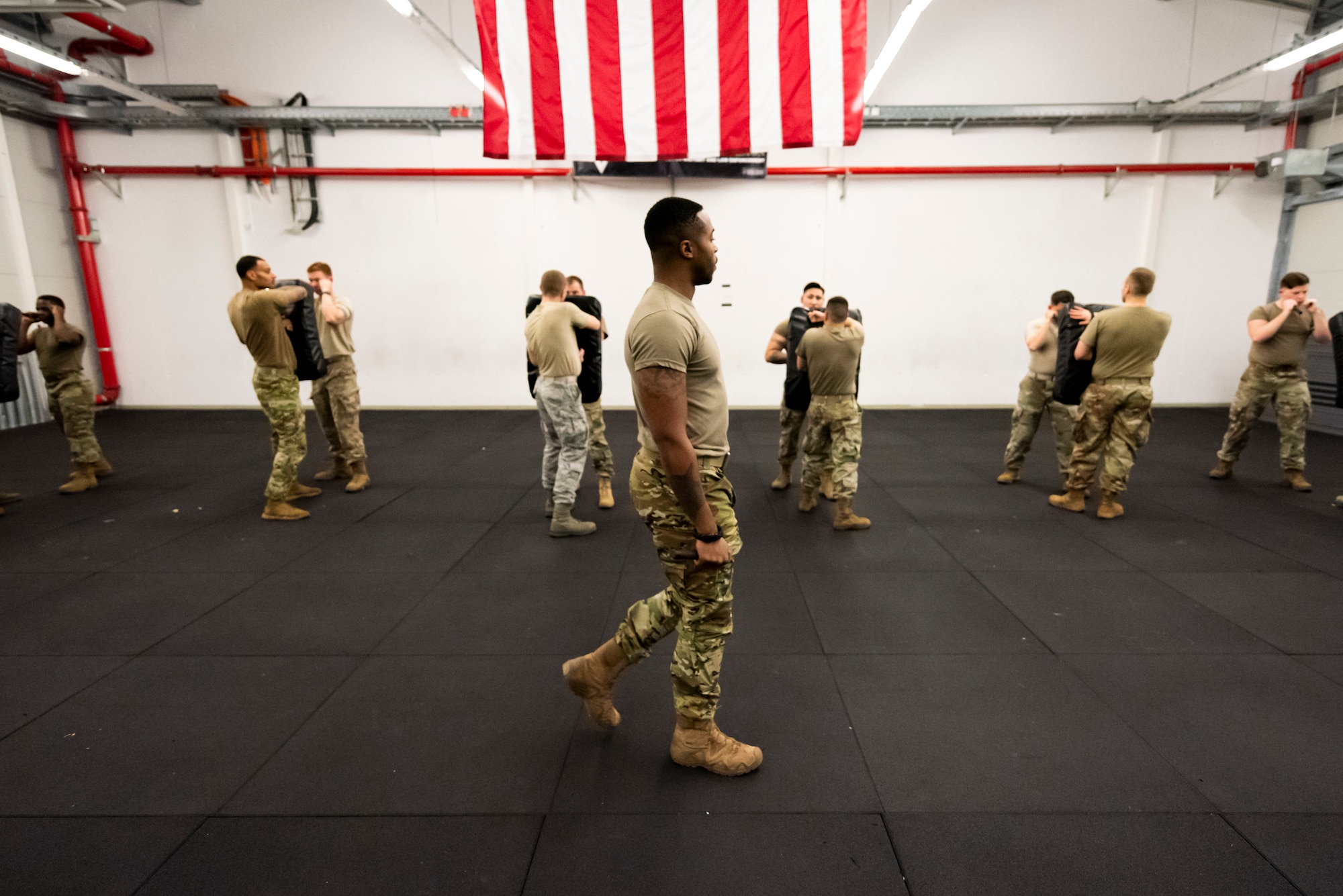 U.S. Air Force Airmen train on baton striking using shield bags during a Leader Led Training Course at Ramstein Air Base, Germany, Dec. 6, 2019. The Air Force designed the LLTC allow defenders from around the Air Force to receive an instructor certification in ground combat skills. (U.S. Air Force photo by Staff Sgt. Devin Nothstine)