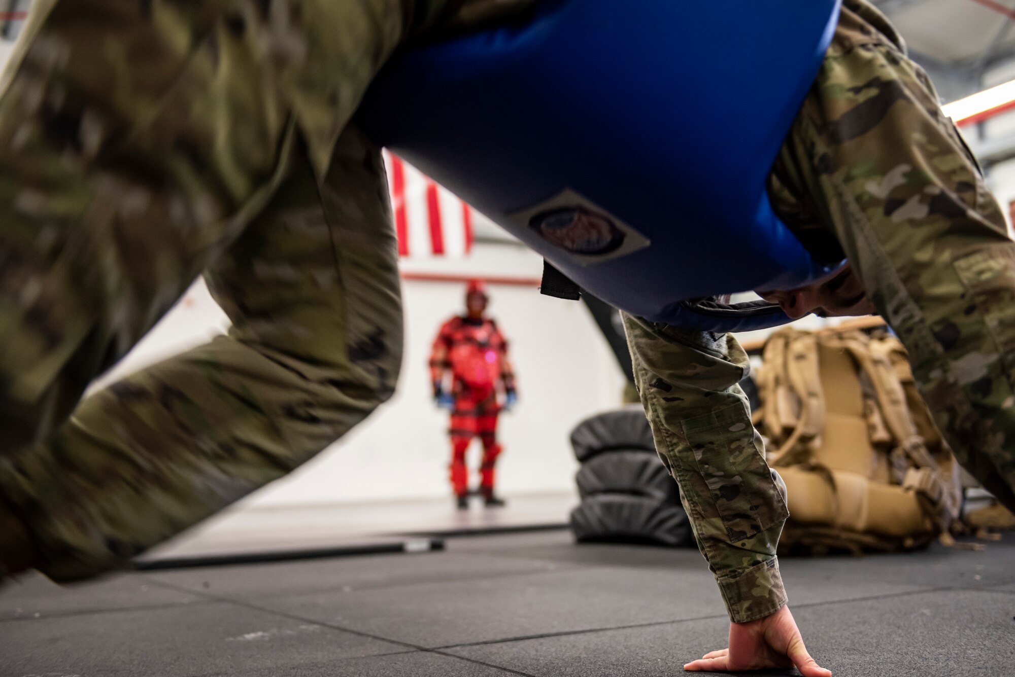 A U.S. Air Force Airmen does mountain climbers before sparring with another Airman during a Leader Led Training Course at Ramstein Air Base, Germany, Dec. 7, 2019. The Airman did mountain climbers to simulate a real-world altercation where she may not be at full strength during a situation. (U.S. Air Force photo by Staff Sgt. Devin Nothstine)