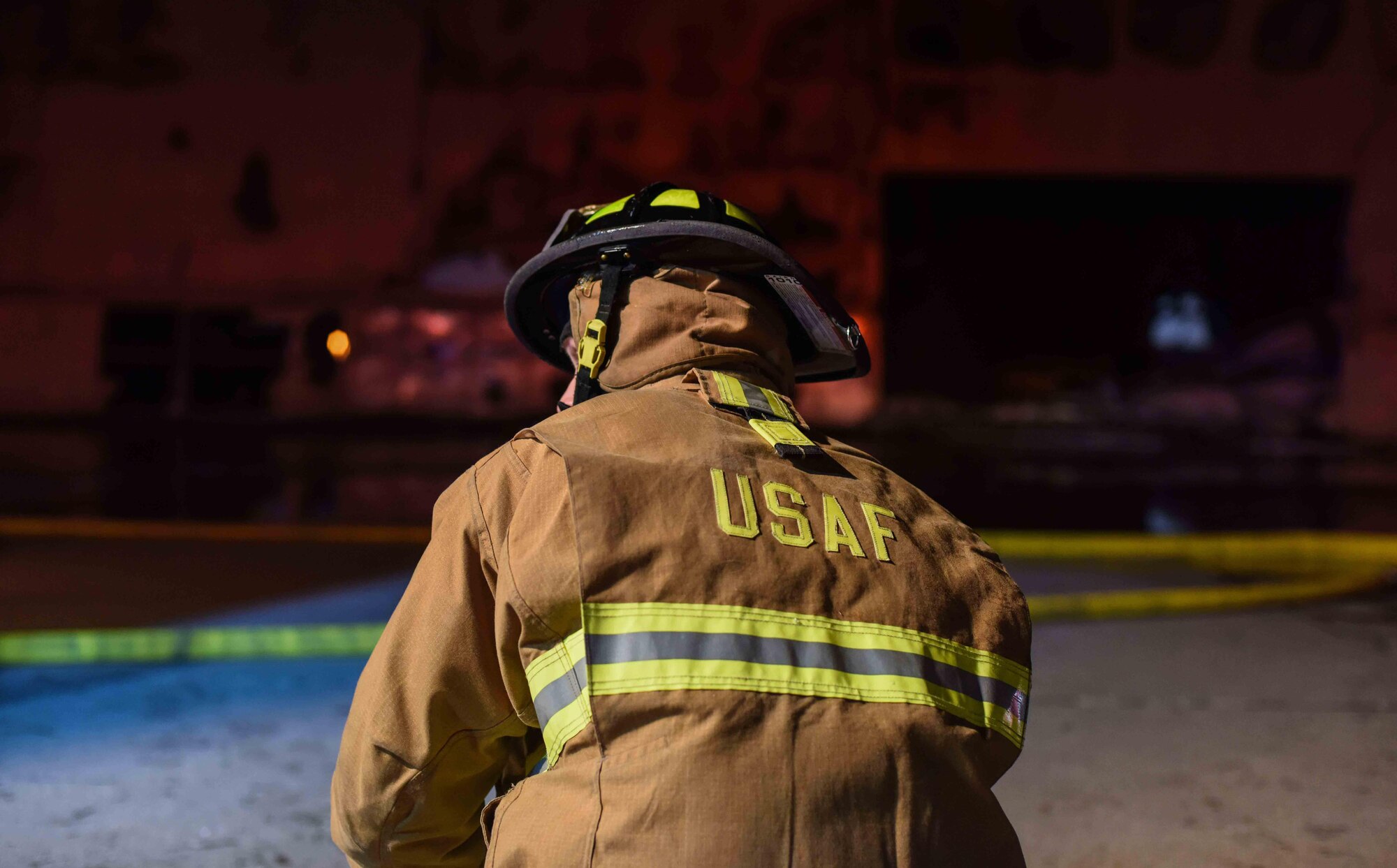 A firefighter checks to make sure his gear is ready to be used Dec. 28, 2019, at Minot Air Force Base, North Dakota. These oxygen tanks are used to ensure the firefighters don’t inhale any smoke from the fire. (U.S. Air Force Photos By Airman 1st Class Caleb S. Kimmell)