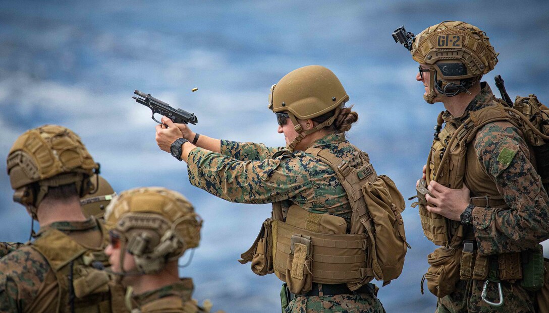 Cpl. Chelsie Villela, participates in a gun shoot aboard the amphibious assault ship USS Bataan, Dec. 28.