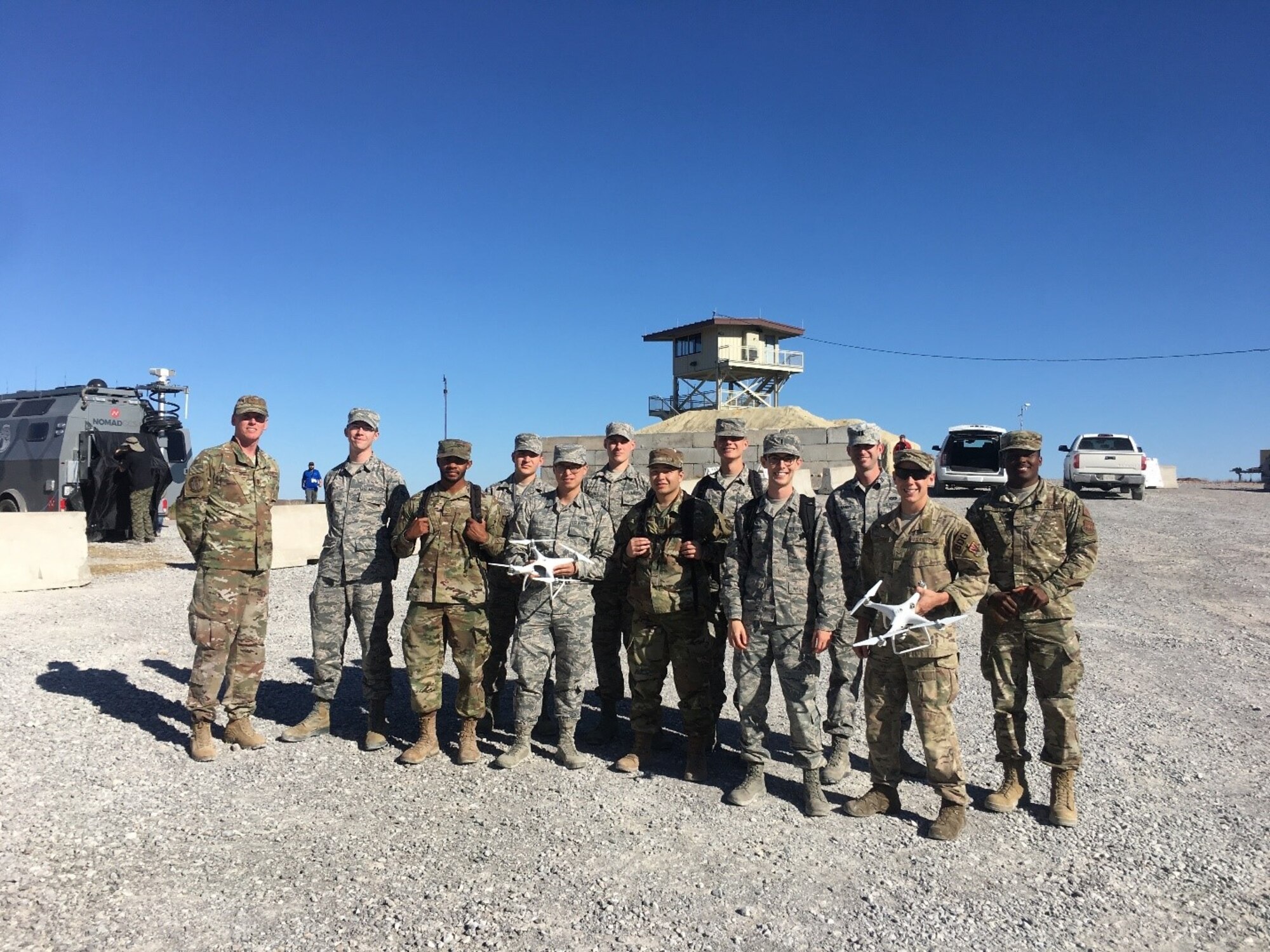 Air Force Airmen who operated directed energy, or DE, weapons during the Army’s Maneuver and Fires Integrated Experiment, or MFIX, October 2019, at Fort Sill, Oklahoma. Using high energy laser and high power microwave technologies, the DE weapons defeated a variety of unmanned aerial systems as part of an airbase air defense experiment. (U.S. Army photo by MFIX team)