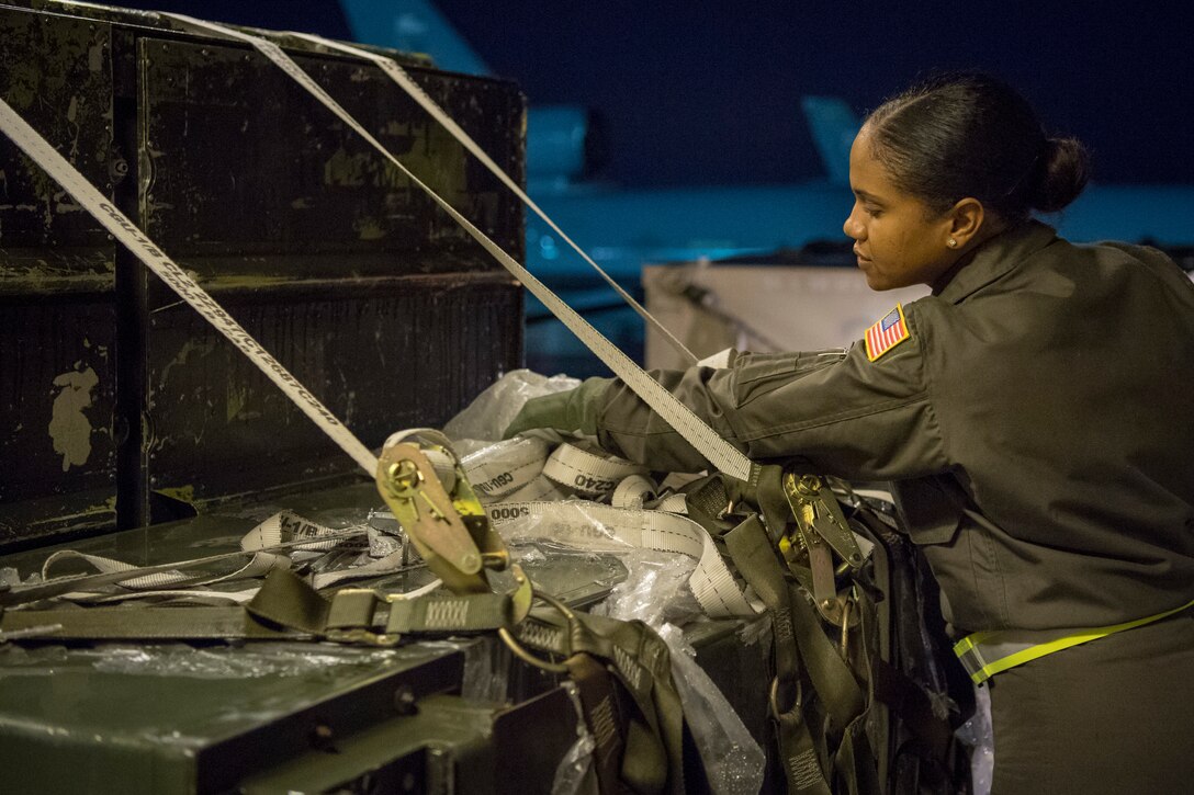 U.S. Air Force Staff Sgt. Jamila Lopez Daniel, a KC-10 Extender boom operator with the 78th Air Refueling Squadron, 514th Air Mobility Wing, checks a pallet of cargo being loaded onto a KC-10 Extender, Jan. 3, 2020. Members from the 78th ARS flew a sortie to refuel the U.S. Navy Blue Angels as well as ship cargo from Travis Air Force Base, Calif., to Joint Base Pearl Harbor-Hickam, Hawaii. (U.S. Air Force photo by Senior Airman Ruben Rios)