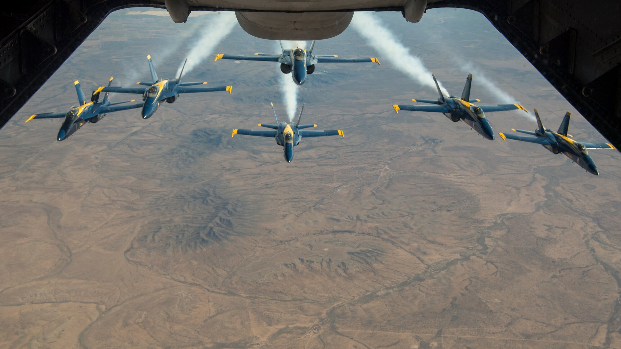 The U.S. Navy Blue Angels fly in formation after being refueled by a KC-10 Extender operated by the 78th Air Refueling Squadron, 514th Air Mobility Wing, Joint Base McGuire-Dix-Lakehurst, N.J., Jan. 3, 2020. Members from the 78th ARS flew a sortie to refuel the U.S. Navy Blue Angels as well as ship cargo from Travis Air Force Base, Calif., to Joint Base Pearl Harbor-Hickam, Hawaii. (U.S. Air Force photo by Senior Airman Ruben Rios)